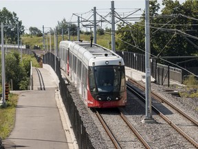 A train moves along the Confederation Line LRT system near Lees Station on July 29.