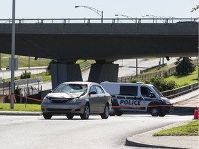 Scene of a police investigation in Gatineau on Boulevard Montclair where a man was struck by a car (pictured) while being chased by police/ The man died later of his injuries.