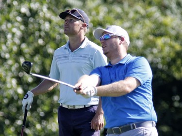 Paul Lahey, left, and partner Jeff Towner take part in the Ottawa Sun Scramble at the Marshes Golf Club on Saturday.