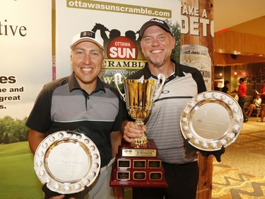 Marc Albert, left, and partner Serge Fortin winners of the Mens D division pose for a photo at the Ottawa Sun Scramble at the Marshes Golf Club on Saturday.