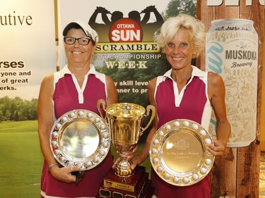 Marie Lusson, left, and partner Lee Zomer winners of the Ladies C division pose for a photo at the Ottawa Sun Scramble at the Marshes Golf Club on Saturday.