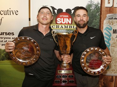 Trevor Allard, left, and Brenden McGuire pose for a photo after winning the Mens B division at the Ottawa Sun Scramble at the Marshes Golf Club on Saturday.