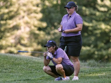 Brenda Pilon, left, and Lise Jubinville take part in the Ottawa Sun Scramble at the Eagle Creek Golf Club on Sunday.