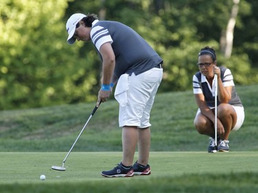 Luci Leblanc, right, and Shari Johnson take part in the Ottawa Sun Scramble at the Eagle Creek Golf Club on Sunday.