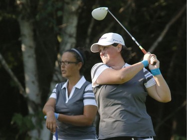 Luci Leblanc, left, and Shari Johnson take part in the Ottawa Sun Scramble at the Eagle Creek Golf Club on Sunday.