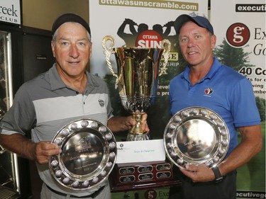 Mike Riopelle, left, and Glenn Wilson winners of the Senior B Championship pose for a photo at the Ottawa Sun Scramble at the Eagle Creek Golf Club on Sunday.