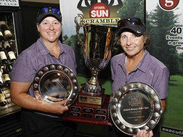 Lise Jubinville, left, and Brenda Pilon winners of the Ladies Champioship pose for a photo at the Ottawa Sun Scramble at the Eagle Creek Golf Club on Sunday.