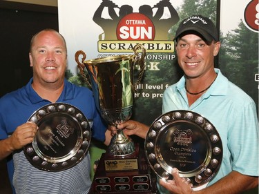 Kyle Koski, left, and Allen McGee winners of the Open Championship pose for a photo at the Ottawa Sun Scramble at the Eagle Creek Golf Club on Sunday.