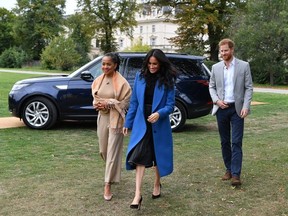 Meghan, Duchess of Sussex arrives with her mother Doria Ragland and Prince Harry, Duke of Sussex to host an event to mark the launch of a cookbook with recipes from a group of women affected by the Grenfell Tower fire at Kensington Palace on September 20, 2018 in London, England.