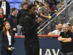 Gael Monfils of France addresses the spectators after pulling out of his match against Rafael Nadal of Spain due to injury at the Rogers Cup at IGA Stadium on Aug. 10, 2019 in Montreal.