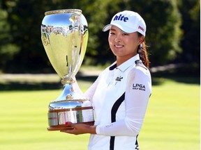Jin Young Ko of Korea poses with the CP Women's Open Championship Trophy following the final round at Magna Golf Club on August 25, 2019 in Aurora, Canada.