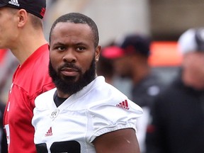 Trevor Harris (L) and William Powell (29) of the Ottawa Redblacks during practice at TD Place in Ottawa, September 21, 2018.