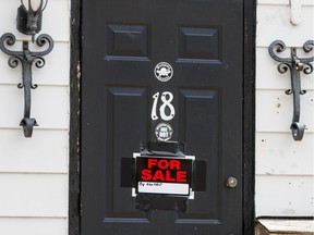 The Outlaws clubhouse at 18 Ladouceur Street in Ottawa with a ForSale by owner sign on the front door. August 12, 2019. Errol McGihon/Postmedia