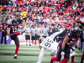 Ottawa Redblacks #13 Richie Leone kicks the ball in the first quarter against the Hamilton Tiger-Cats at TD Place, Saturday.