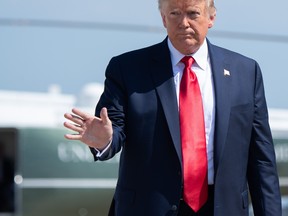 U.S. President Donald Trump waves before boarding Air Force One prior to departing from Joint Base Andrews, Maryland, on August 9, 2019. (SAUL LOEB / AFP)SAUL LOEB/AFP/Getty Images)