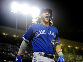 Blue Jays’ Bo Bichette celebrates under the lights after hitting a solo home run against the Dodgers during the sixth inning on Wednesday night at Dodger Stadium. Bichette finished with a pair of homers, both off Clayton Kershaw. (USA TODAY SPORTS PHOTO)
