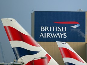 British Airways logos are seen on tail fins at Heathrow Airport, February 23, 2018. (REUTERS/Hannah McKay/File Photo)