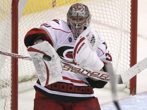 Hurricanes goaltender Cam Ward makes a stop against the Jets during NHL action at the MTS Centre in Winnipeg on March 18, 2012.