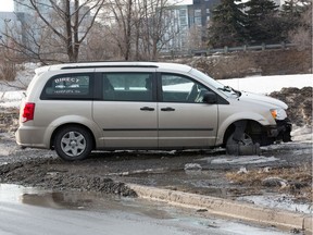 A van sits at the side of a road following the wild events of March 20.