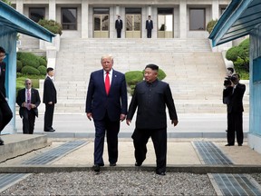 A handout photo provided by Dong-A Ilbo of North Korean leader Kim Jong Un and U.S. President Donald Trump inside the demilitarized zone (DMZ) separating the South and North Korea on June 30, 2019 in Panmunjom, South Korea.