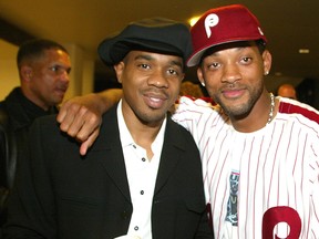 Actors Duane Martin and Will Smith pose for photos at the premiere of "Deliver Us From Eva" at the Cinerama Dome and after-party at the Sunset Room on Jan. 29, 2003 in Hollywood, Calif.