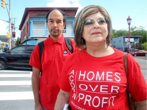 ACORN members Mavis Finnamore and Paul Morrow in Chinatown, where there are a number of rooming houses.
