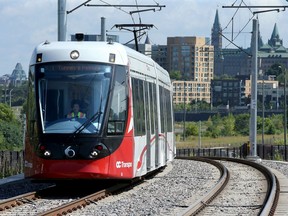 With Parliament Hill as a backdrop, an LRT train on a test run pulls into Bayview station on Thursday (August 8, 2019).