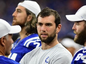Indianapolis Colts quarterback Andrew Luck (12) watches the action against the Chicago Bears from the sideline at Lucas Oil Stadium. (Thomas J. Russo-USA TODAY Sports)
