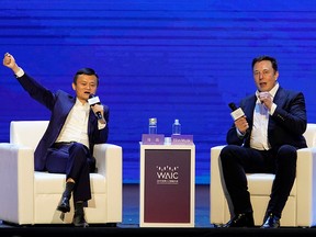 Tesla CEO Elon Musk and Alibaba Group Holding Ltd executive chairman Jack Ma attend the World Artificial Intelligence Conference (WAIC) in Shanghai, China, Aug. 29, 2019.