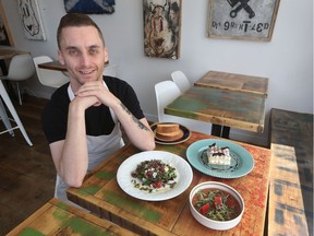 Chef-owner Jason McLelland with some of his dishes at Grunt, his new restaurant in Mechanicsville.