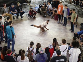 People break dances during the House of Paint Hip Hop Festival in Ottawa on Saturday, September 6, 2014.