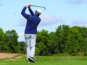 Graham Gunn his his tee shot on the 12th hole of the Talon course at GreyHawk during the Sun Scramble yesterday. Gunn and Stan Hogan lead the TMSI Senior Division by two strokes.   Photo by Jean Levac/Postmedia Network