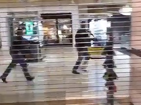 Police officers are seen inside the Cielo Vista mall in El Paso, Texas, after a shooter entered a store and opened fire on Saturday. This still image has been taken from social media video.