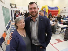 Jody Mitic poses for a photo with his mother, Joanne Fisher-Mitic, at a 2018 event where he announced that he would not be seeking re-election as a city councillor.