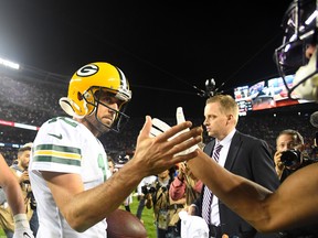 Green Bay Packers quarterback Aaron Rodgers celebrates after defeating Chicago on Thursday night. (USA TODAY SPORTS)