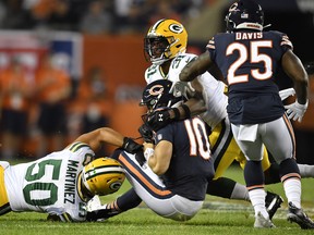 Chicago Bears quarterback Mitchell Trubisky is sacked by two Green Bay Packers on Thursday night. (USA TODAY SPORTS)