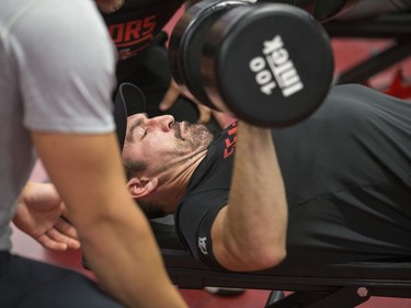 Defenceman Hubert Labrie lifts weights as the Ottawa Senators begin training camp with medicals and fitness testing