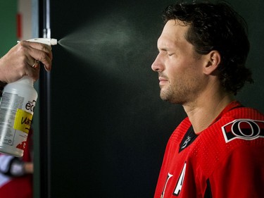 Ron Hainsey is sprayed with water (fake sweat) for a video segment  as the Ottawa Senators begin training camp with medicals and fitness testing.