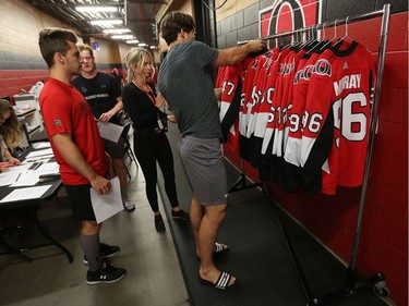 Players pick out their jerseys as the Ottawa Senators begin training camp with medicals and fitness testing