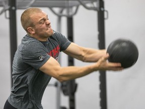Mark Borowiecki throws a medicine ball as the Ottawa Senators began training camp in September 2019 with medicals and fitness testing.