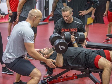 Dylan DeMelo lifts weights as the Ottawa Senators begin training camp with medicals and fitness testing.
