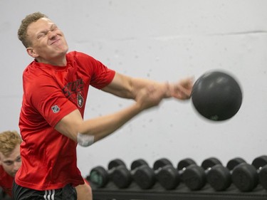 Brady Tkachuk throws a medicine ball as the Ottawa Senators begin training camp with medicals and fitness testing