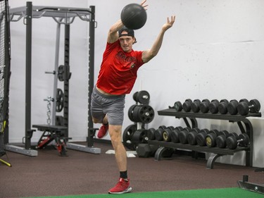 Thomas Chabot throws a medicine ball as the Ottawa Senators begin training camp with medicals and fitness testing.