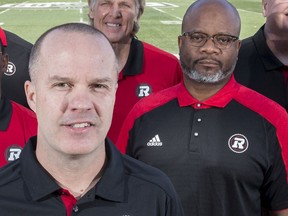 FILES: Ottawa Redblacks's Head Coach Rick Campbell with coaching staff, including Bob Dyce , special teams coordinator