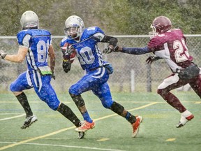 # 10 Patrice Rene breaks away for the touchdown in High School Football final on the Carleton University field in 2013.