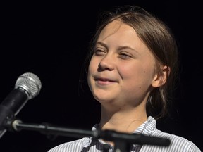 Swedish climate activist Greta Thunberg takes to the podium to address young activists and their supporters during the rally for action on climate change on Sept. 27, 2019 in Montreal.