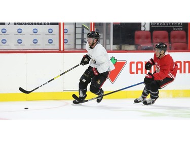 Chris Tierney (L) and Jean-Gabriel Pageau (R) of the Ottawa Senators during training camp in Ottawa, September 13, 2019.