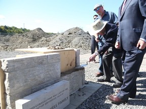 Andy Carswell, 96-year-old  Second World War veteran, lays the cornerstone of the Veterans' House Canso Campus in Ottawa on Monday.