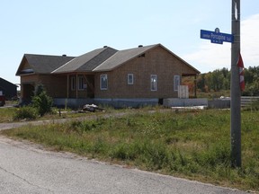 A year after the tornado, some Dunrobin homeowners have rebuilt their homes.