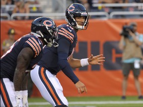 Chicago Bears quarterback Mitchell Trubisky looks toward a wide receiver during the first half of the team's NFL preseason football game against the Carolina Panthers on Thursday, Aug. 8, 2019, in Chicago. (AP Photo/Mark Black )